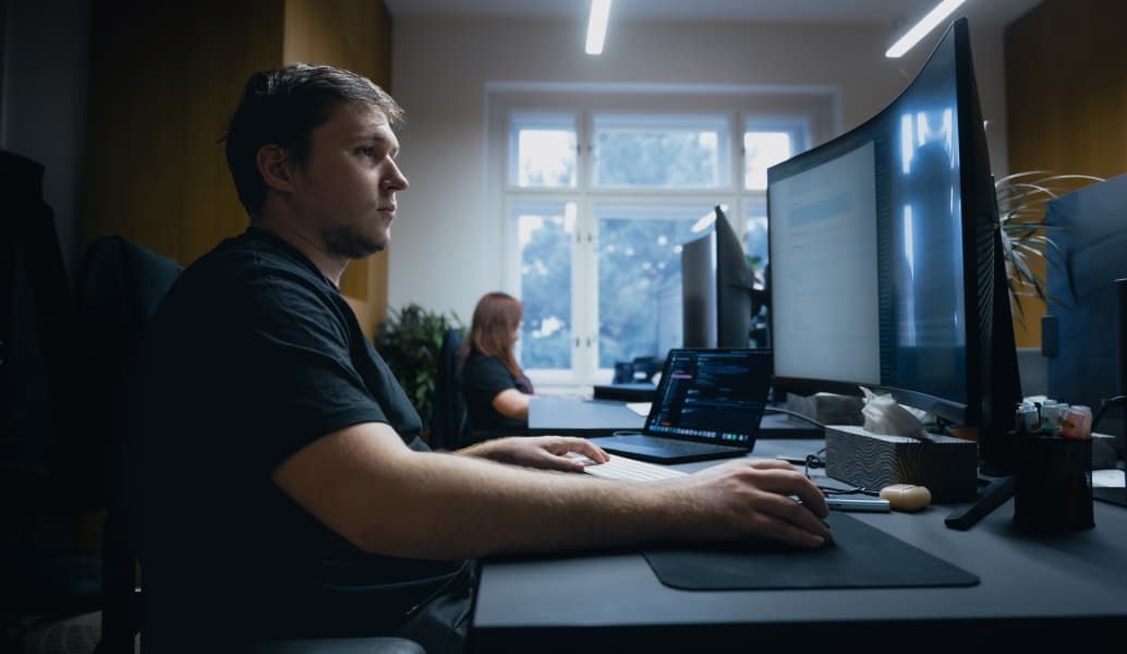 Members of the support team in their office